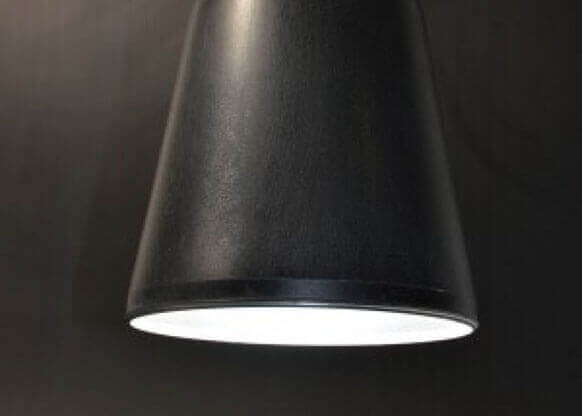 MOLTENI-VERNICI sleek black lamp with dramatic paint effect lighting