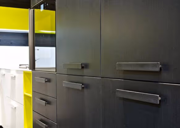 MOLTENI-VERNICI paint effect on sleek gray and yellow industrial cabinets