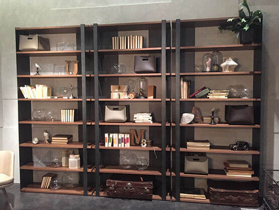 MOLTENI-VERNICI shelves with special oxidation paint effect displaying books, objects