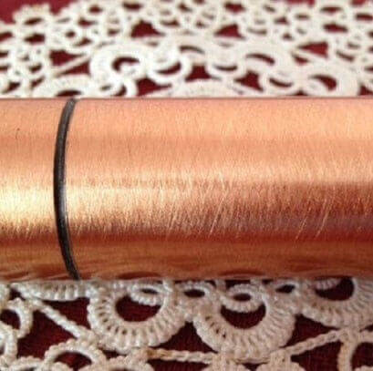 MOLTENI-VERNICI copper paint effect on metallic surface with delicate lace background