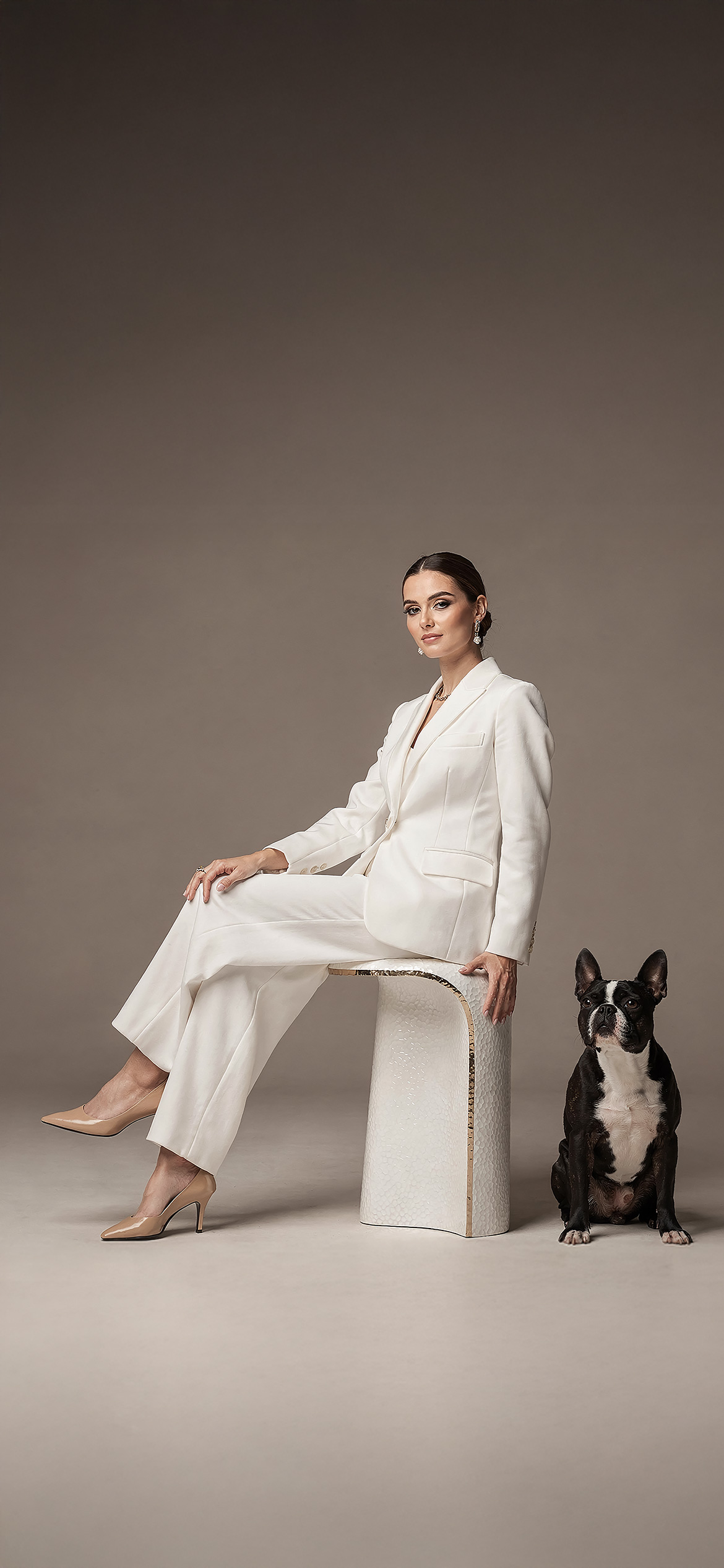 Luxury architectural metal finish by Molteni Vernici applied on a sculptural brass table surface in a contemporary interior.