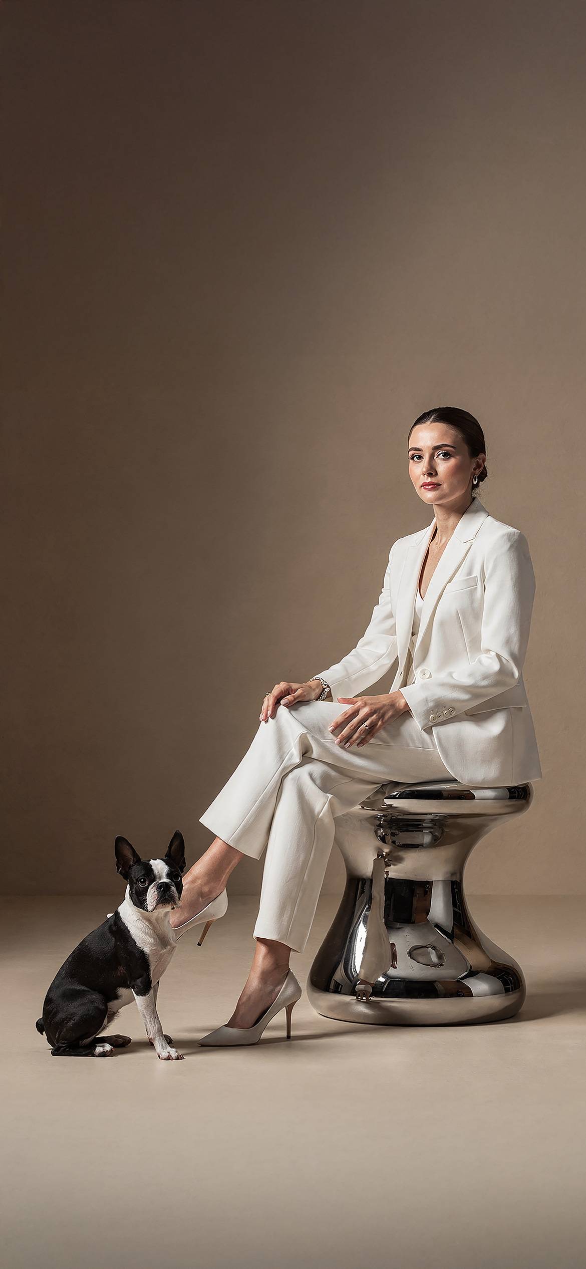 Luxury architectural metal finish by Molteni Vernici applied on a sculptural brass table surface in a contemporary interior.