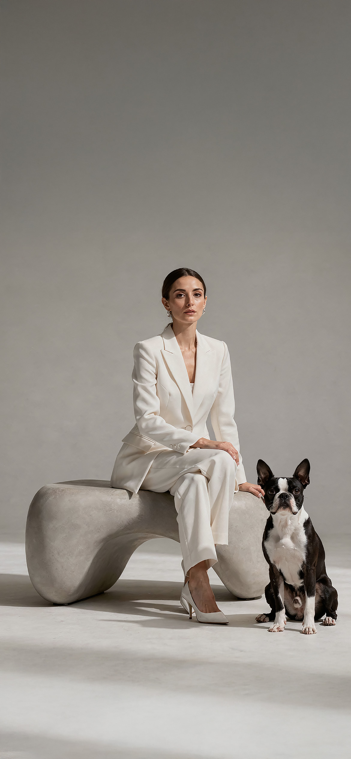 Luxury architectural metal finish by Molteni Vernici applied on a sculptural brass table surface in a contemporary interior.