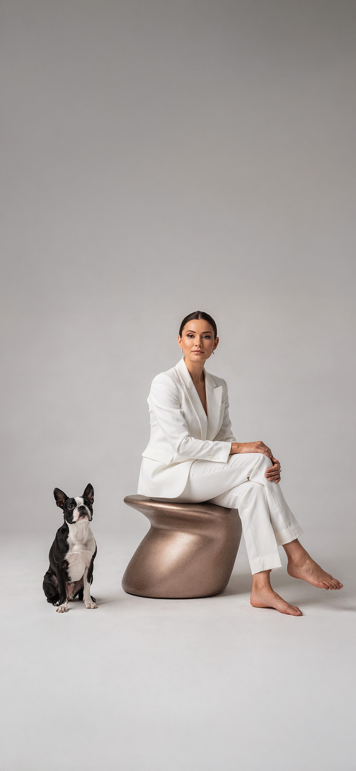 Luxury architectural metal finish by Molteni Vernici applied on a sculptural brass table surface in a contemporary interior.