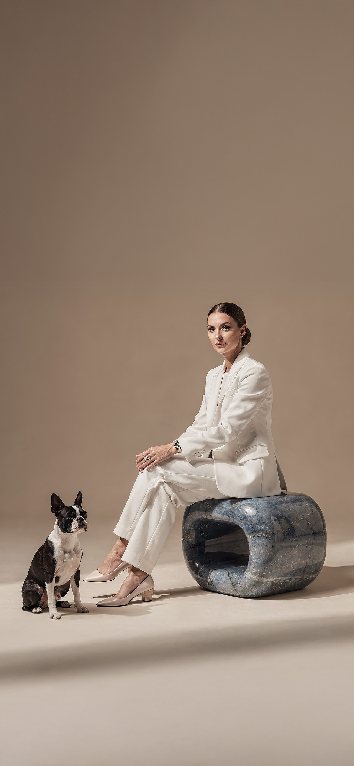 Luxury architectural metal finish by Molteni Vernici applied on a sculptural brass table surface in a contemporary interior.