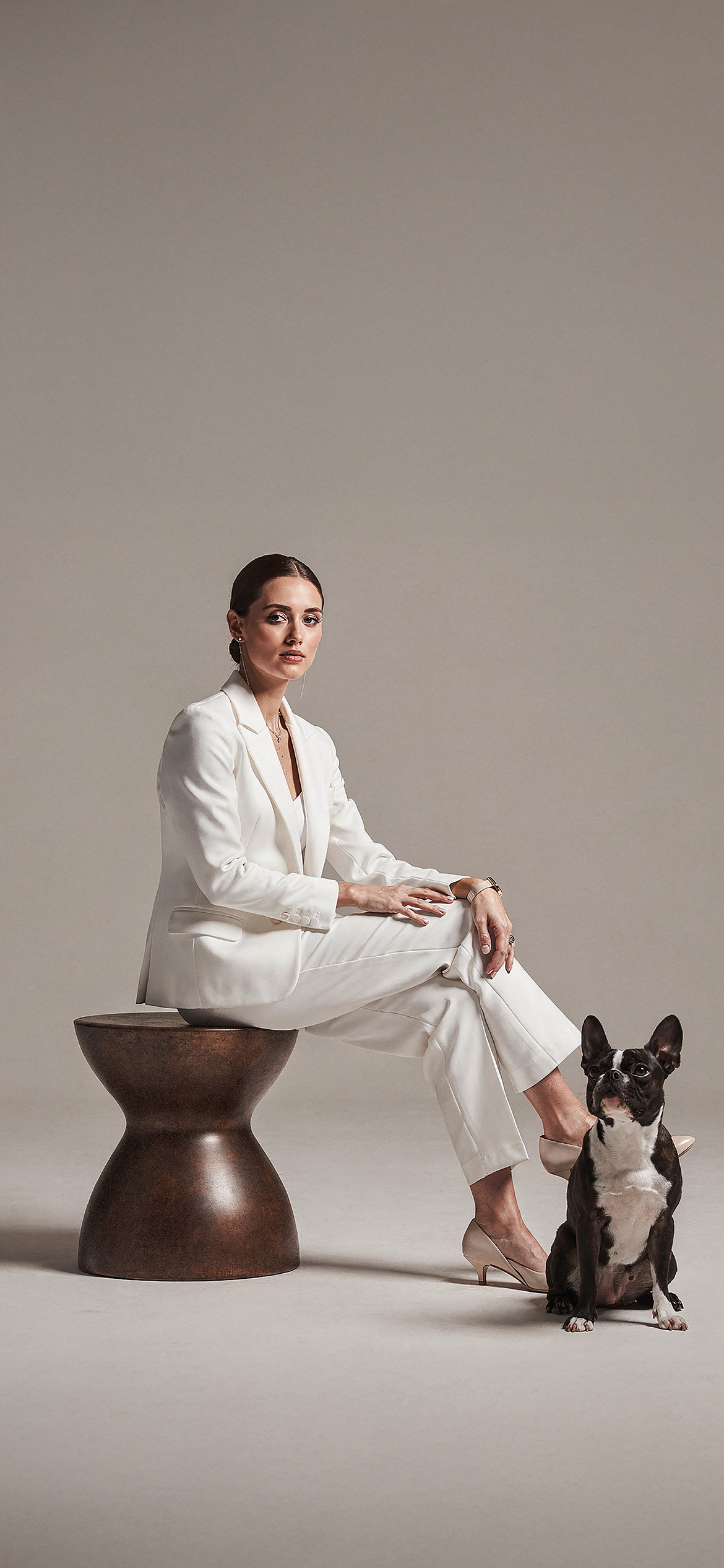 Luxury architectural metal finish by Molteni Vernici applied on a sculptural brass table surface in a contemporary interior.