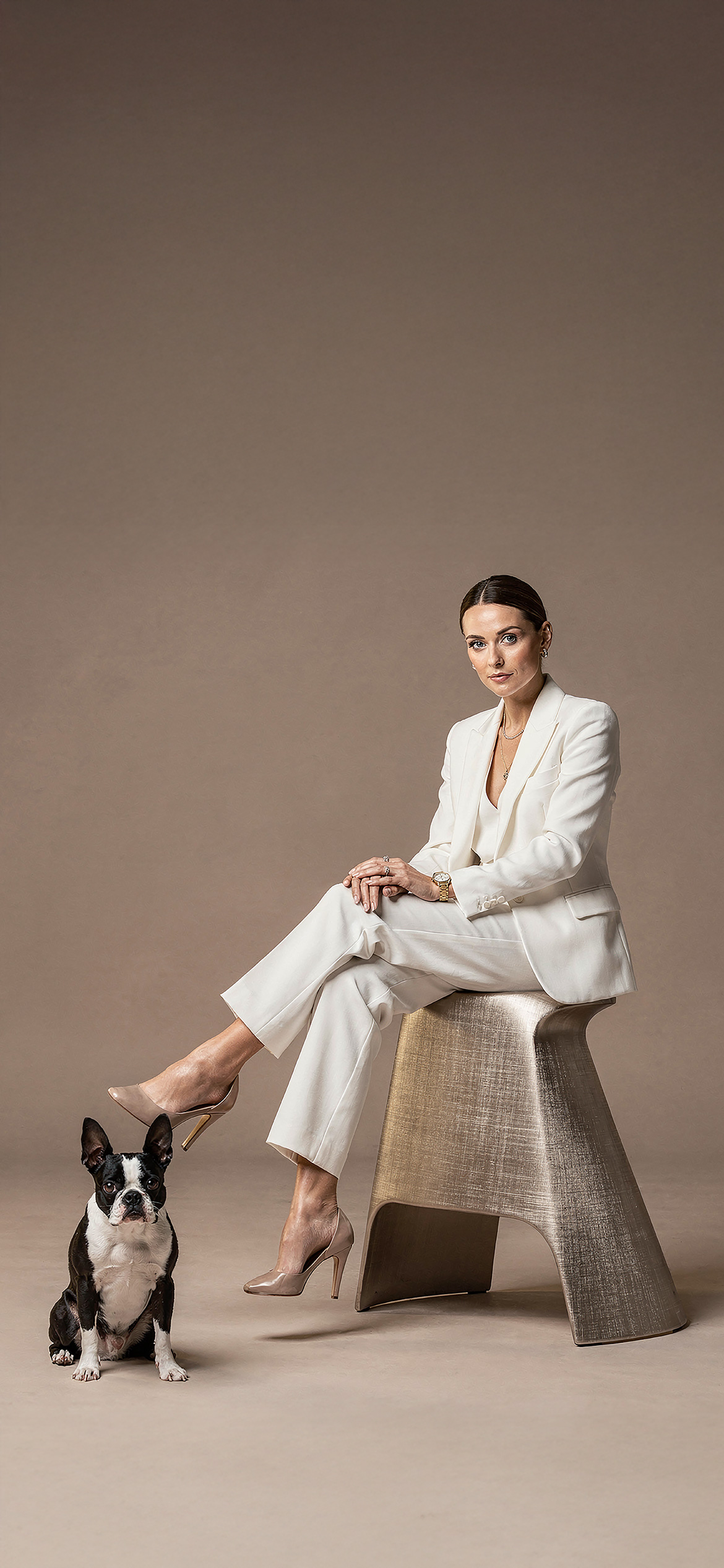 Luxury architectural metal finish by Molteni Vernici applied on a sculptural brass table surface in a contemporary interior.