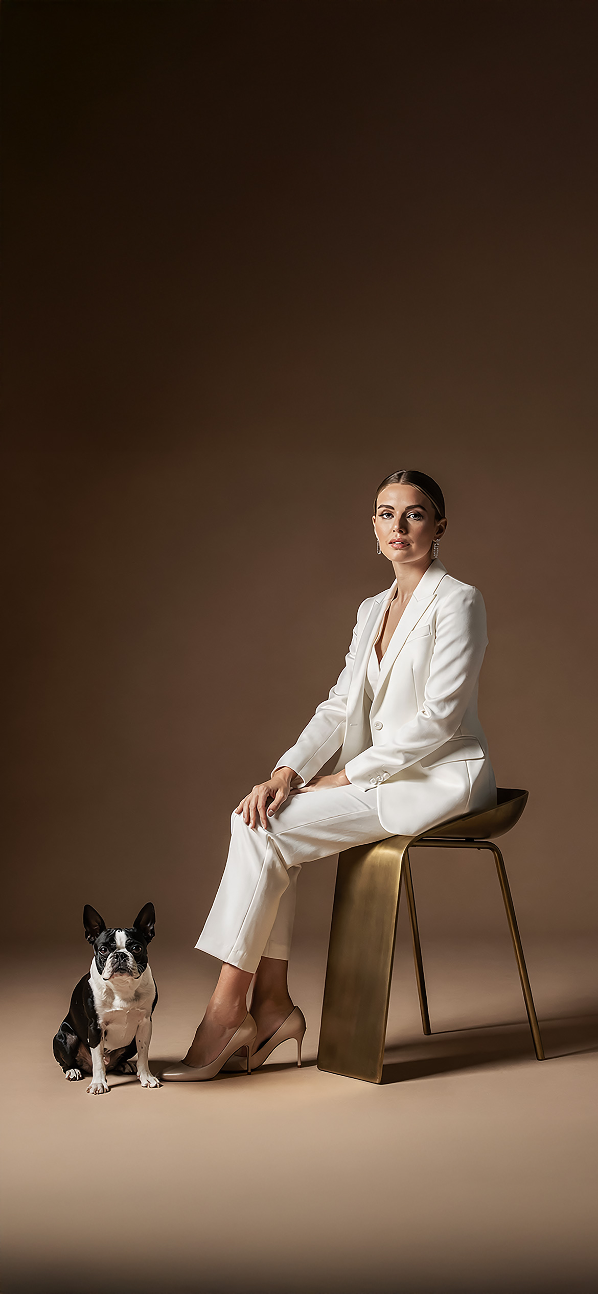 Luxury architectural metal finish by Molteni Vernici applied on a sculptural brass table surface in a contemporary interior.