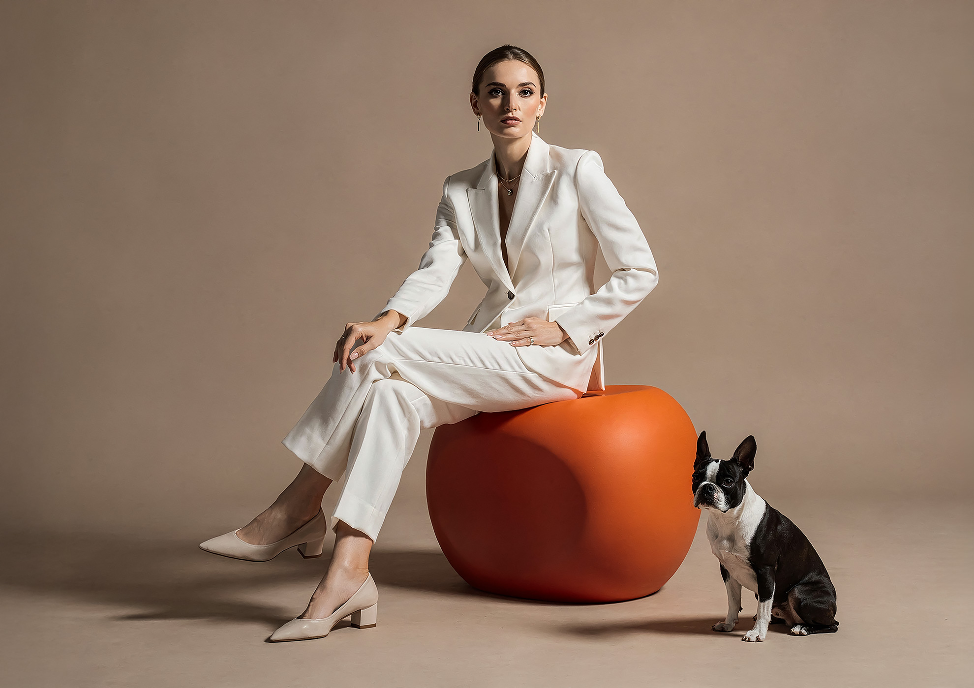 Minimalist architectural scene with a woman in a black couture dress standing on a reflective surface, expressing Molteni Vernici’s approach to special paints, advanced surface technologies, and design-driven material innovation.