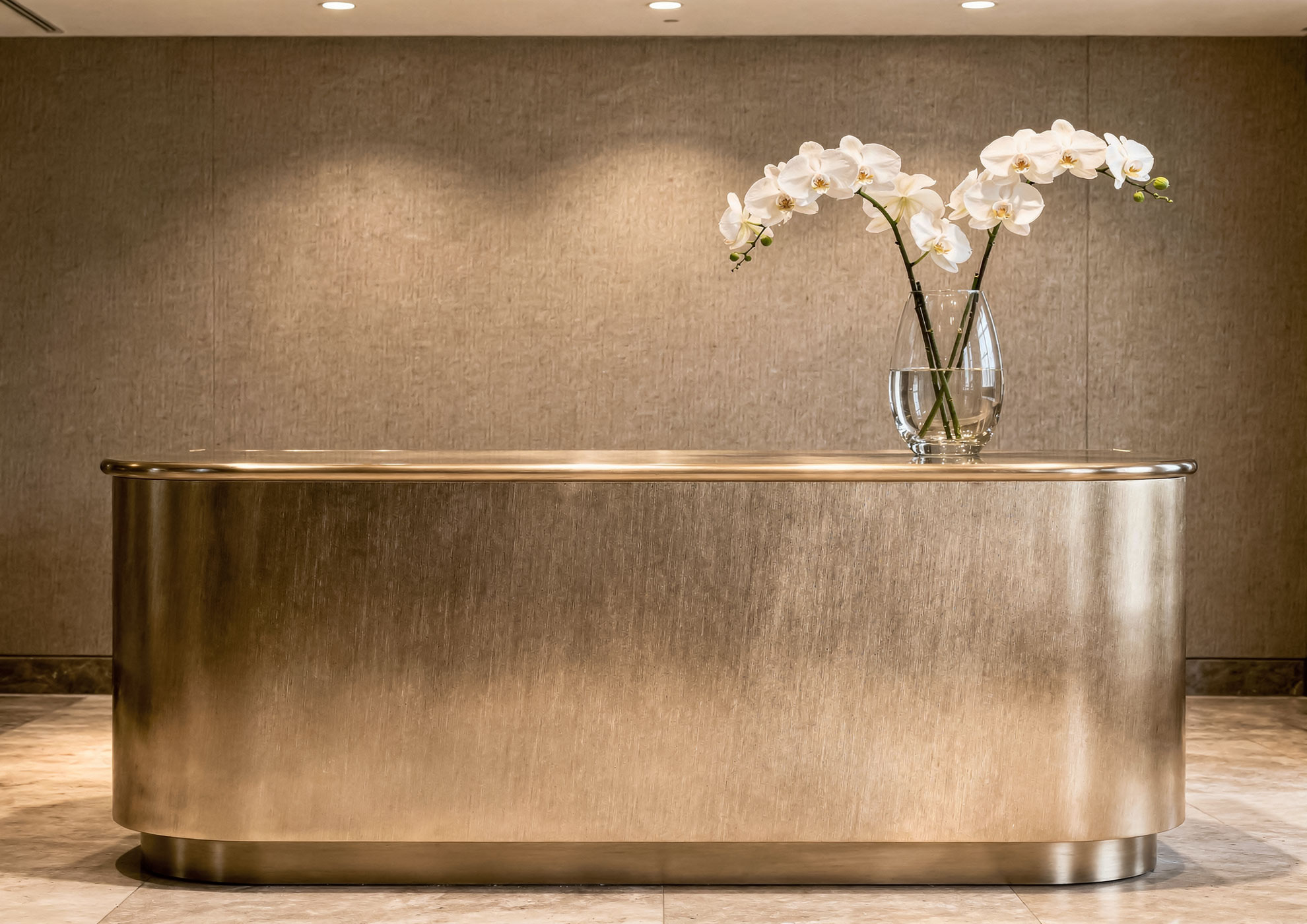 Luxury reception desk with Brushed Brass Never Brushed satin galvanic finish Molteni Vernici, premium brushed metallic surface for contemporary interior design excellence.
