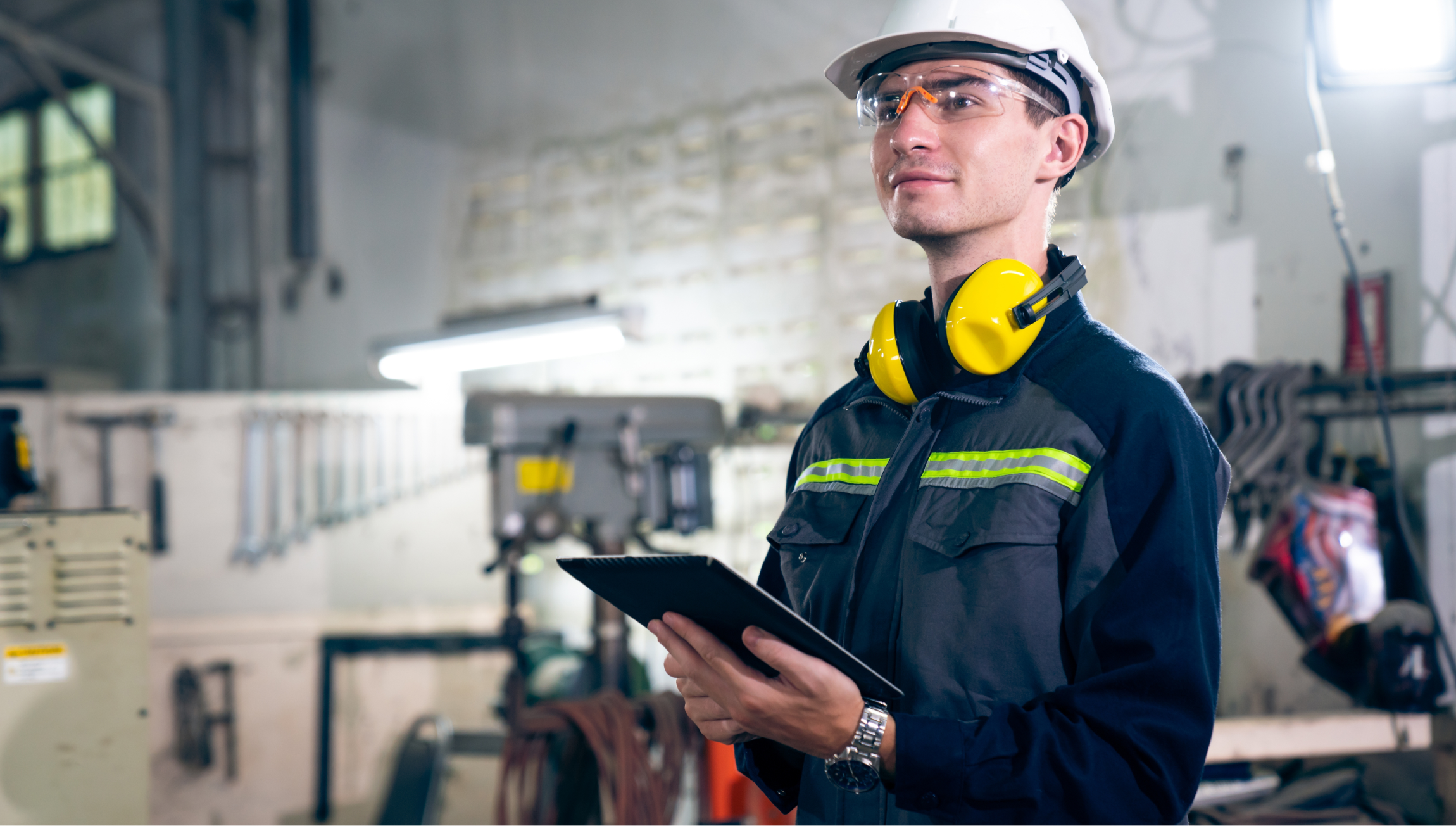 Front-line worker checking something with a tablet device in his hands.
