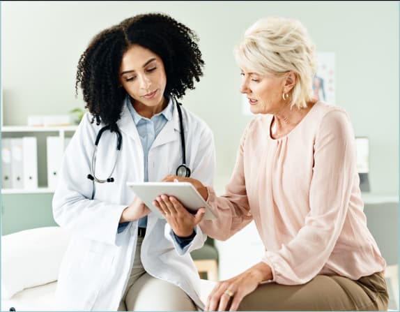 a doctor and patient view their virtual chart