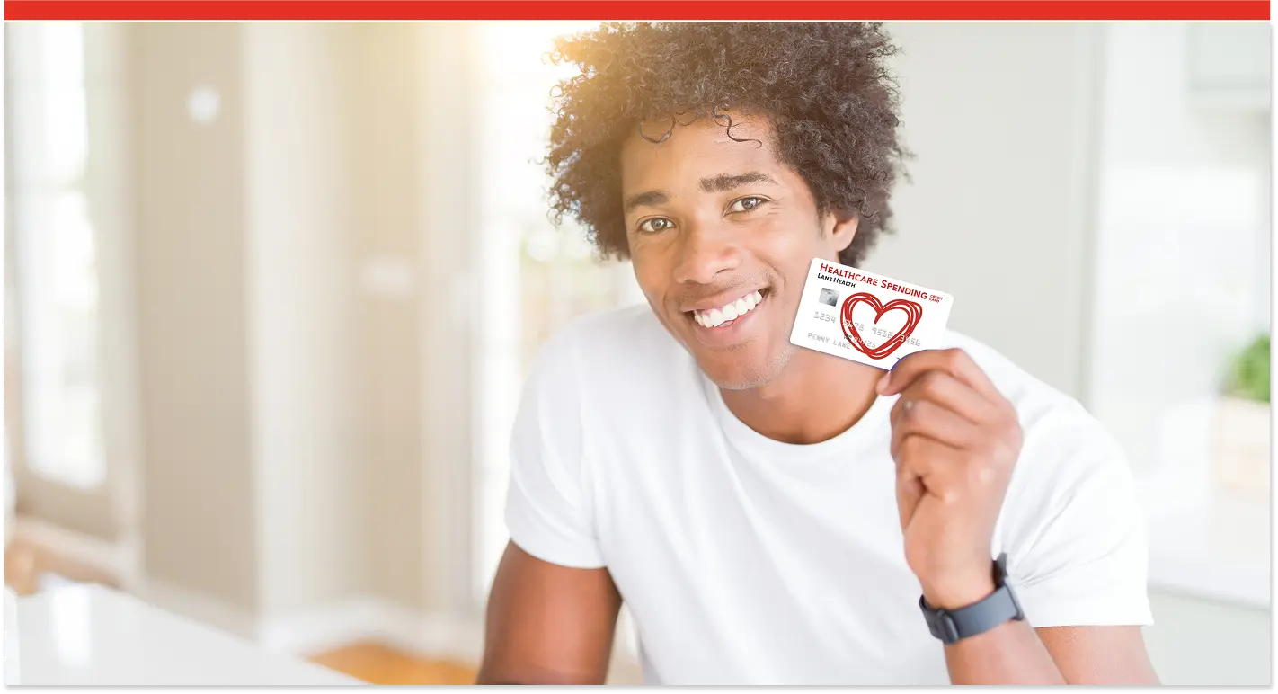 Image of man holding the Lane Health healthcare spending card