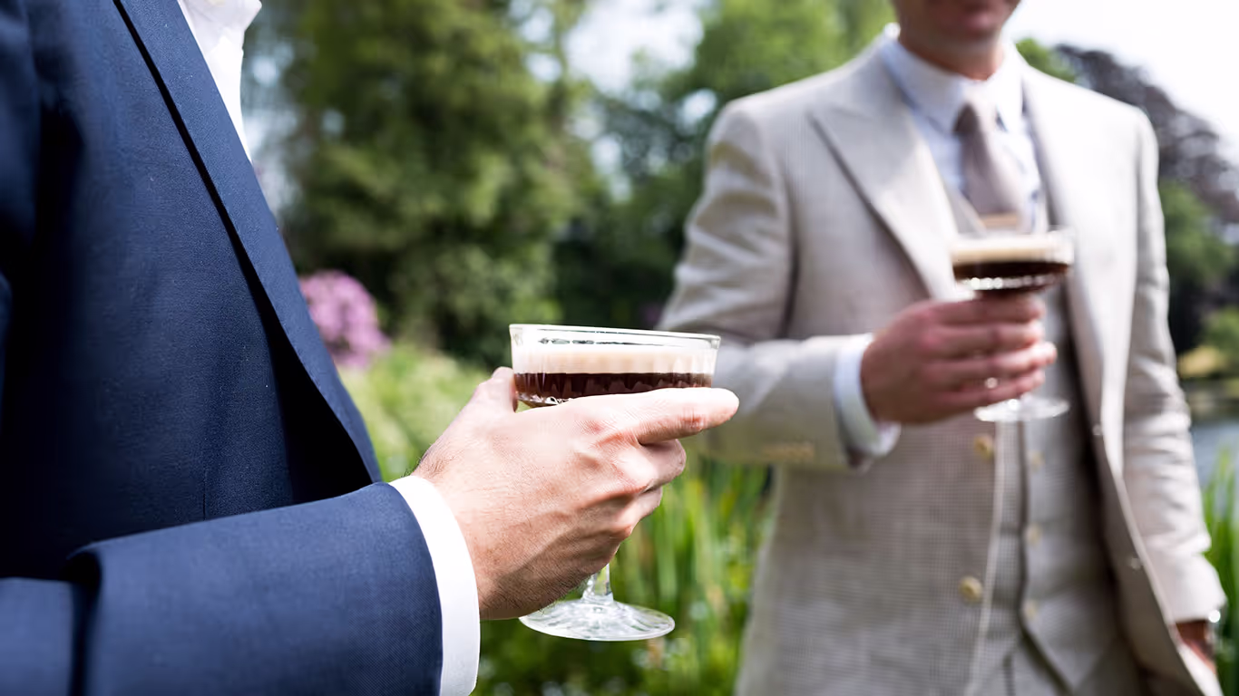Two gents drinking espresso martinis