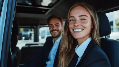 A woman wearing a suit and smiling.