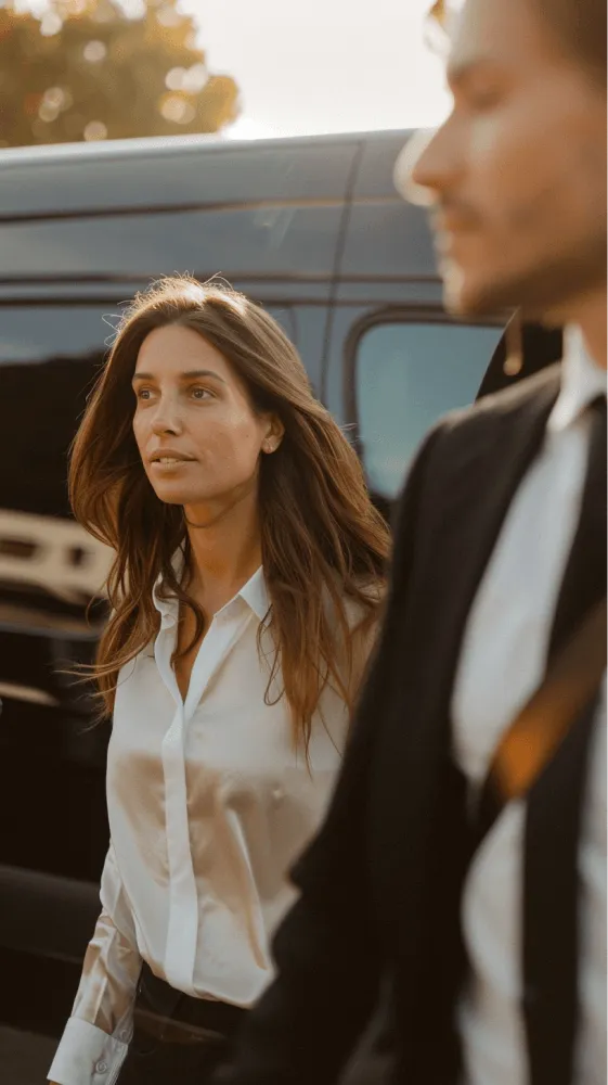 A woman with long hair wearing a white shirt.