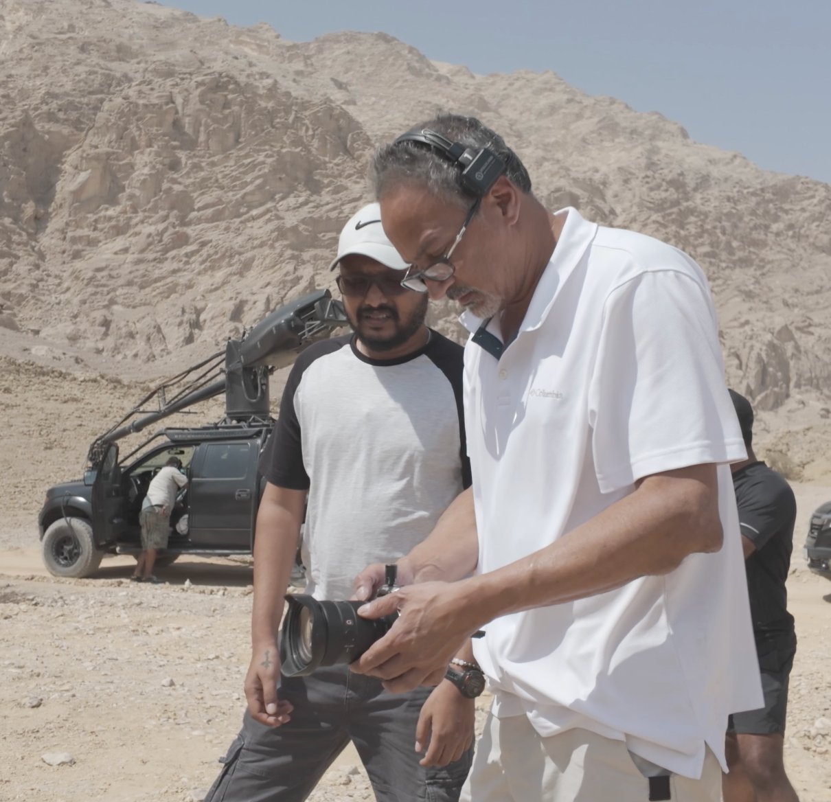 Director reviewing footage on location