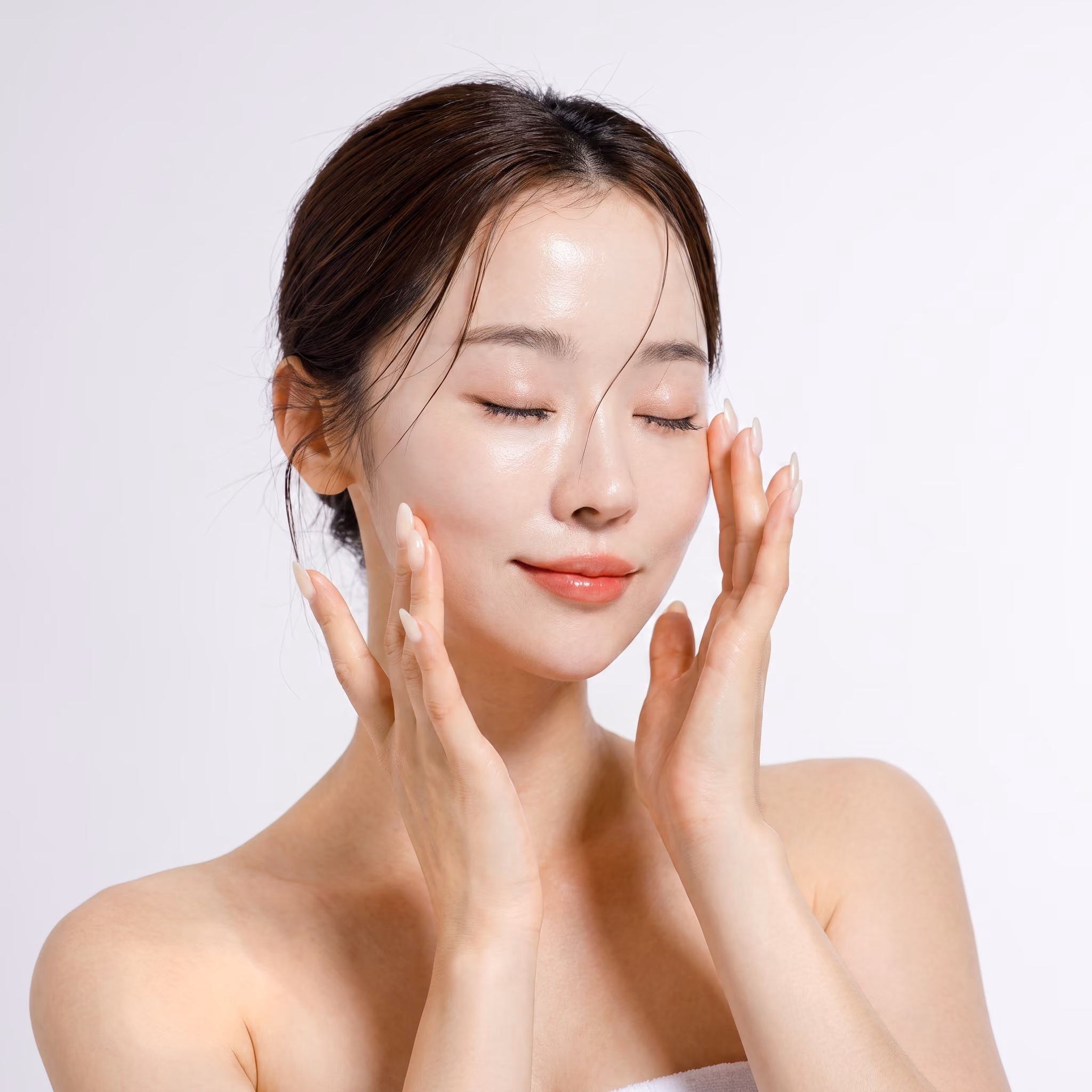 Smiling woman with bright, smooth skin after microneedling rejuvenation treatment