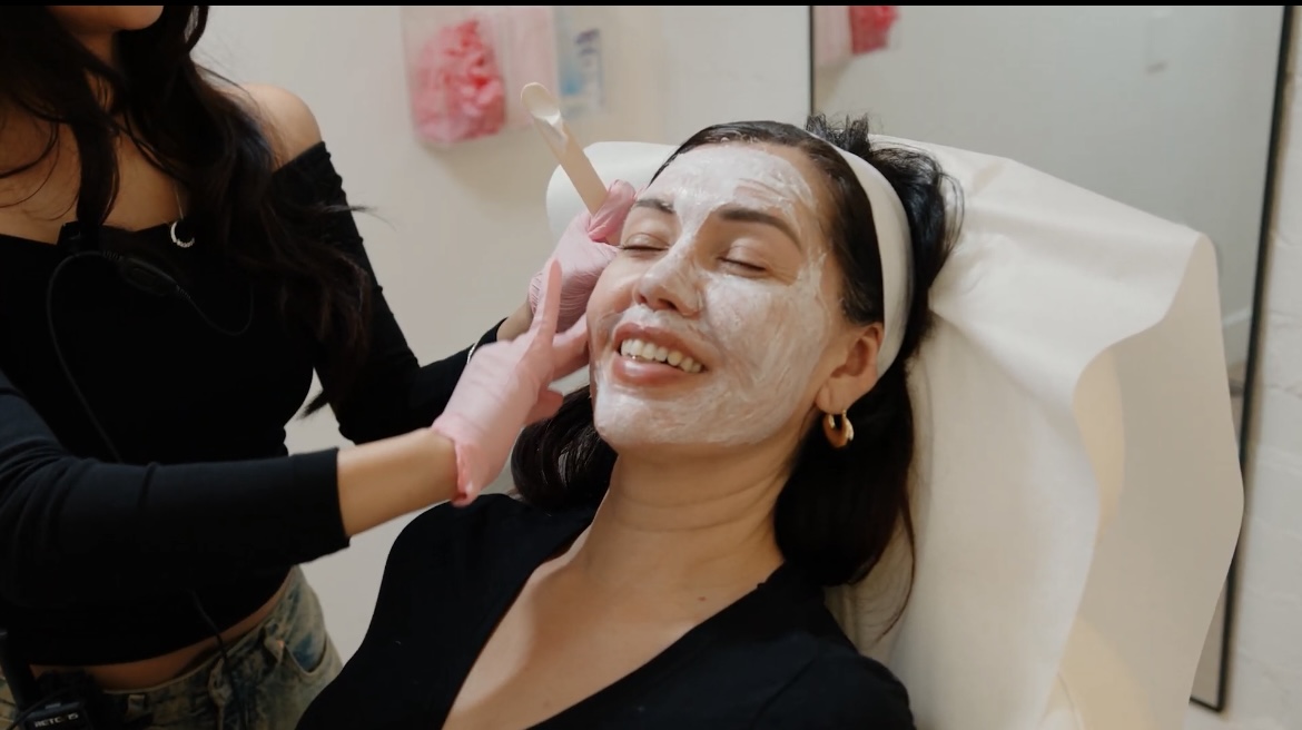 A team member applies a facial mask to a client at LYEV Beverly Hills.