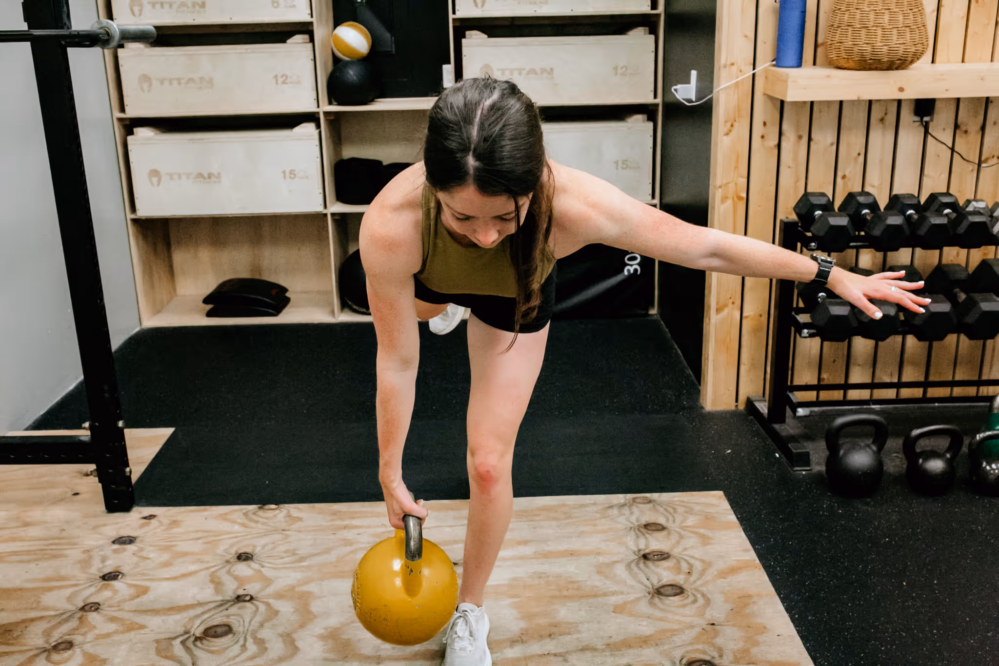 Coach Abby of Wild Dog Athletics demonstrates proper form for athletic exercises.