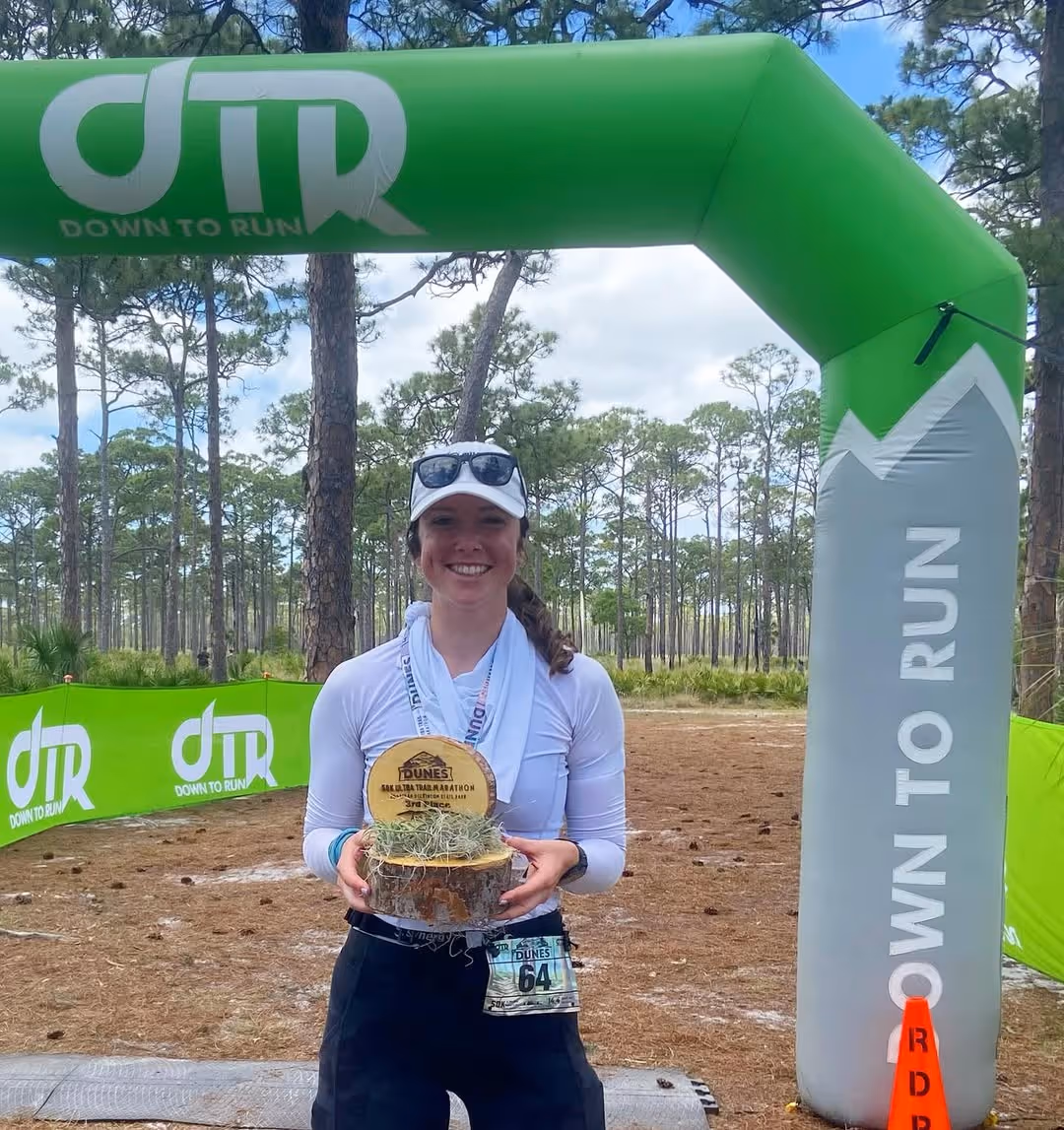 Runner celebrating after completing first half marathon