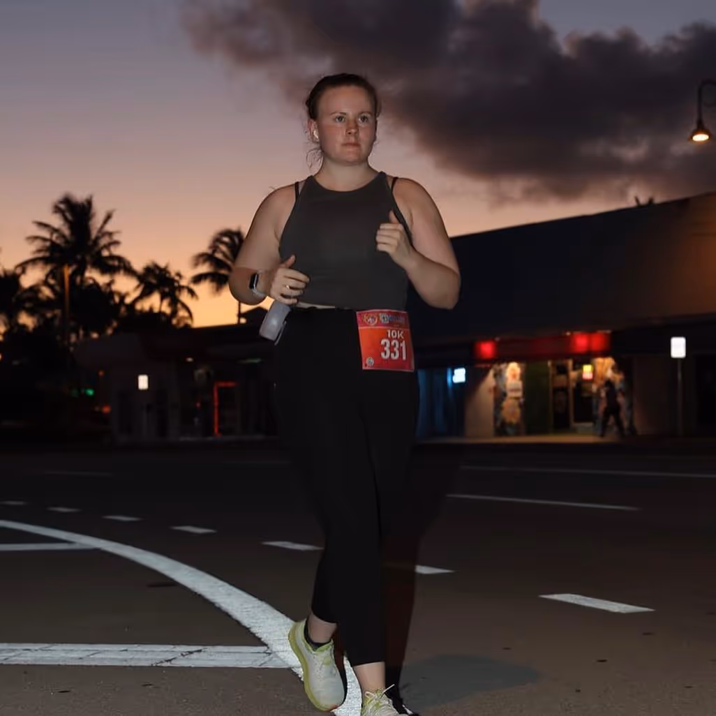 Runner mid-stride on a trail during ultra marathon training