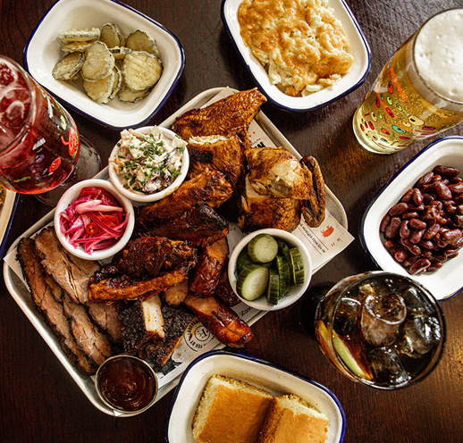 Smokey meat platter with sides and drinks