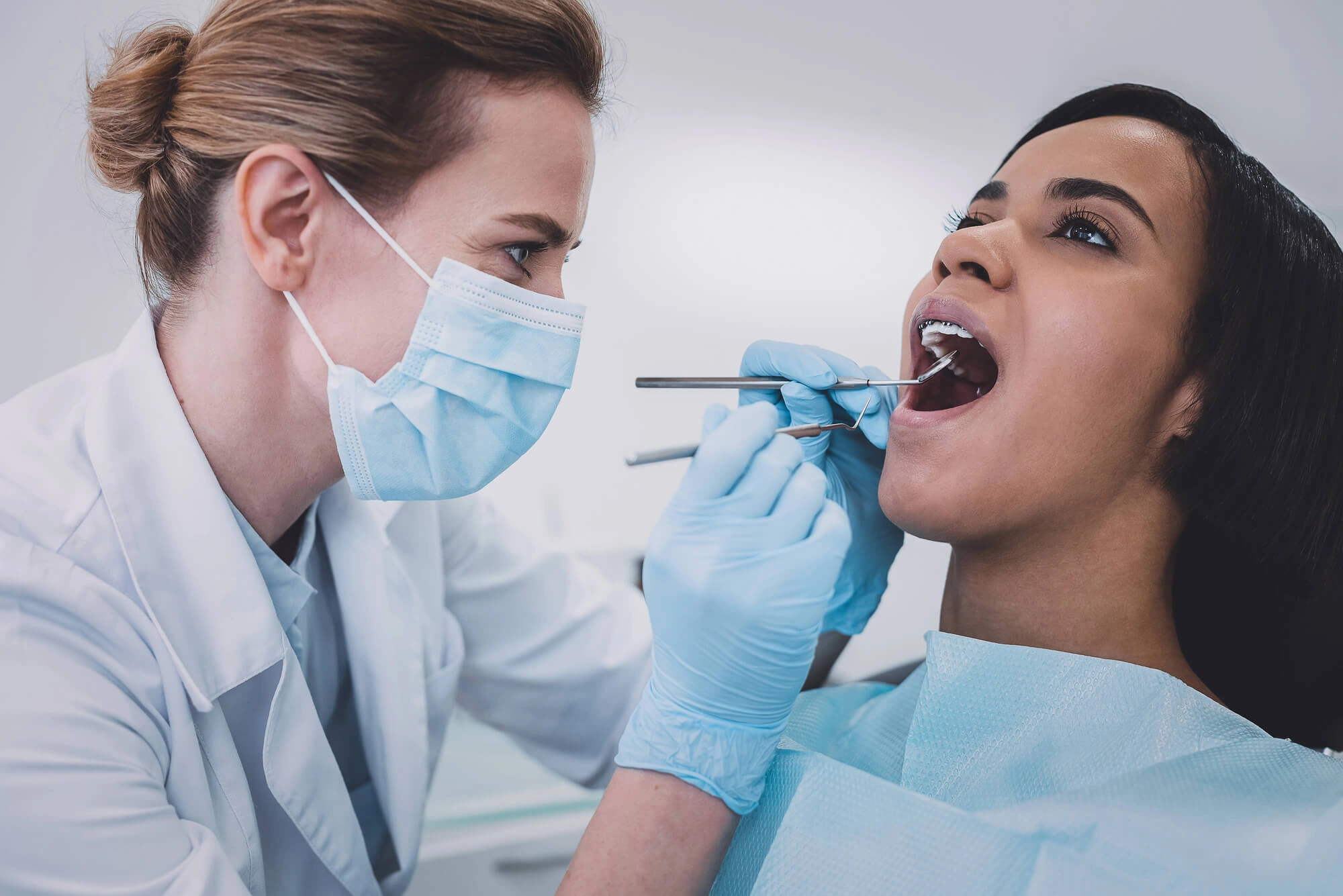 A beautiful smile can last for many years with the right care. If you've invested in cosmetic dentistry, visiting a dentist in Clinton, CT, for regular checkups and following good oral hygiene habits can help keep your veneers looking their best. Although veneers are durable and stain-resistant, proper maintenance is essential for preserving their appearance and protecting the natural teeth underneath. Daily Habits That Help Protect Your Veneers Veneers are thin, custom-made shells that are bonded to the front surface of your teeth to improve their appearance. While porcelain veneers are designed to be strong, they still require consistent care to maximize their lifespan. Good daily habits not only protect the veneers themselves but also help maintain healthy gums and natural teeth, ensuring your smile stays healthy as well as attractive. Maintain Excellent Oral Hygiene Brushing and flossing remain just as important after getting veneers as they were before treatment. While veneers cannot develop cavities, the natural teeth supporting them still can. To help maintain your veneers: Brush twice a day using a soft-bristled toothbrush. Use a non-abrasive toothpaste recommended by your dentist. Floss daily to remove plaque between your teeth. Rinse with an alcohol-free mouthwash if recommended. Keep your regular oral hygiene routine every day. Healthy gums provide the foundation for beautiful veneers and help ensure long-lasting cosmetic results. Avoid Habits That Can Damage Veneers Although veneers are durable enough for everyday eating, certain habits can place unnecessary stress on them and increase the risk of chips or fractures. To help protect your veneers: Avoid chewing on ice, pens, or other hard objects. Don't use your teeth to open packages. Limit biting directly into very hard foods when possible. Wear a mouthguard during contact sports. Ask your dentist about a nightguard if you grind or clench your teeth while sleeping. Making these simple adjustments can help extend the life of your veneers and reduce the likelihood of damage. Can Veneers Become Stained? Porcelain veneers are highly resistant to staining compared to natural tooth enamel. However, the natural teeth surrounding your veneers can still discolor over time, creating uneven color differences. To help maintain a bright, uniform smile: Limit beverages that commonly stain teeth, such as coffee, tea, and red wine. Avoid tobacco products. Rinse your mouth with water after consuming stain-causing foods or drinks. Schedule regular professional dental cleanings. These habits help preserve both your veneers and your overall smile. Why Routine Dental Visits Matter Regular dental examinations allow your dentist to monitor the condition of your veneers and identify any issues before they become larger concerns. During these visits, your dentist can evaluate the bond between the veneer and your natural tooth, assess your gum health, and professionally clean your teeth. Routine care also provides an opportunity to address small problems early, helping your veneers continue to look natural and function properly for many years. Preventive care plays an important role in protecting your cosmetic investment and supporting your long-term oral health. Schedule a Visit with a Dentist in Clinton, CT With proper care and routine dental visits, veneers can continue enhancing your smile for many years. Maintaining excellent oral hygiene and protecting your veneers from unnecessary wear are the best ways to preserve their beauty and function. Friedler Dental Group provides personalized cosmetic and preventive dental care to help patients maintain healthy, confident smiles. Schedule your appointment today to keep your veneers looking their very best.