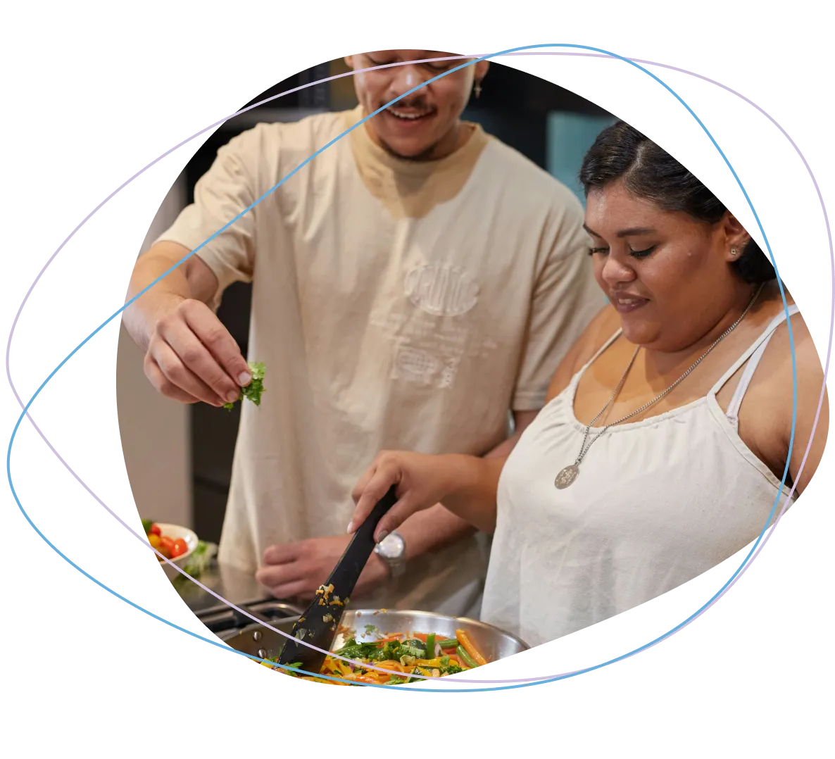 Picture of a person helping someone with thier cooking.