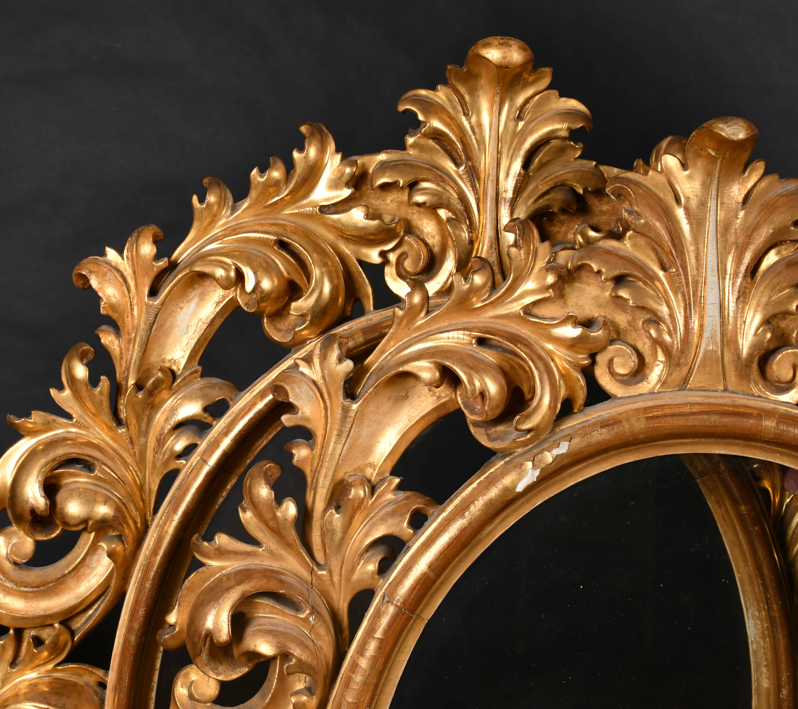 19th Century Italian School. A Fine Near Pair of Oval Carved Giltwood Florentine Frames. Estimate: £800-£1200