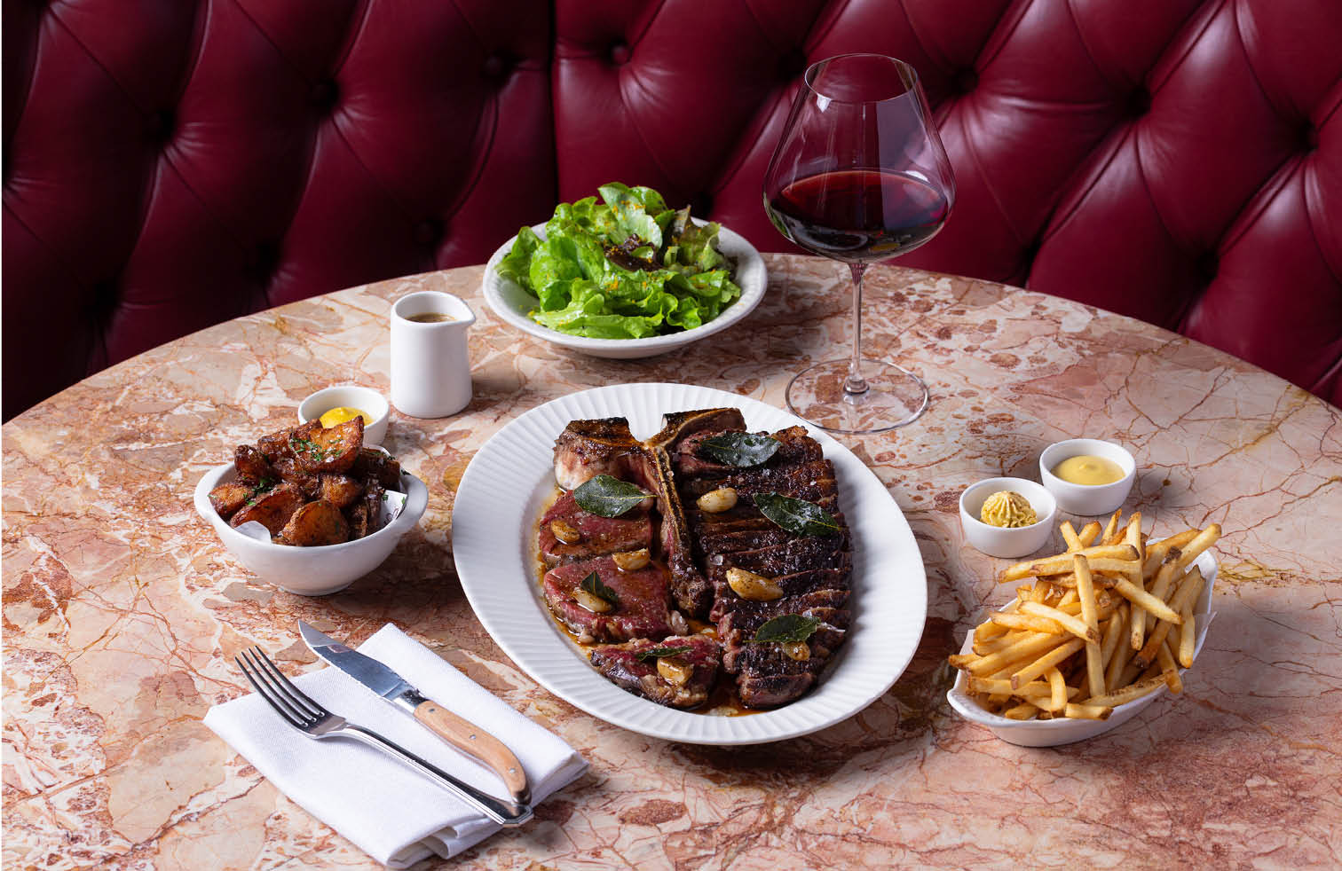 1kg T bone steak to share with fries, green salad and sauces at Armorica Grande Brasserie