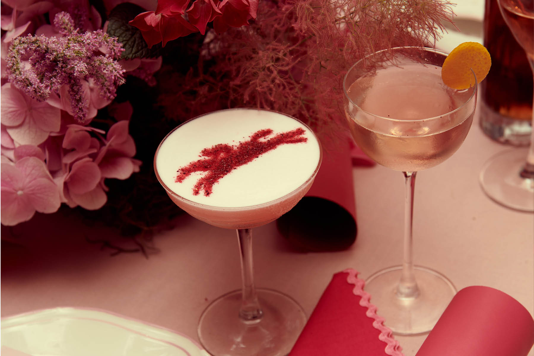 Signature bespoke cocktails with decorative foam and pink florals for an event at Armorica, Surry Hills