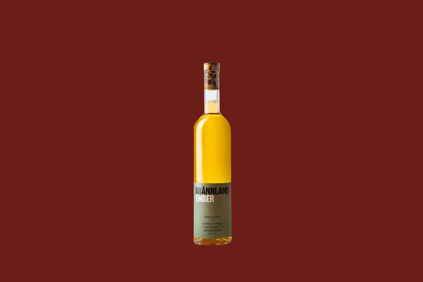 A bottle of Brännland Ember against a red background.