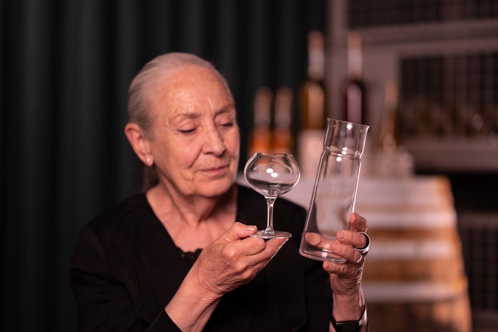 Ingegerd Råman holding a La Pomme glass and carafe.