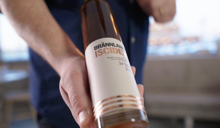 A bottle of Brännland Iscider held ready for serving.