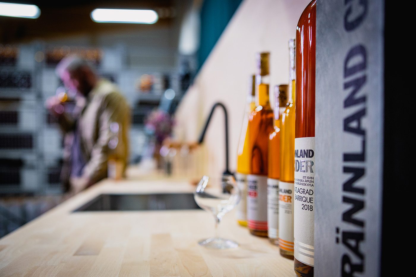 Bottles of ice cider on a worktop in the winery.