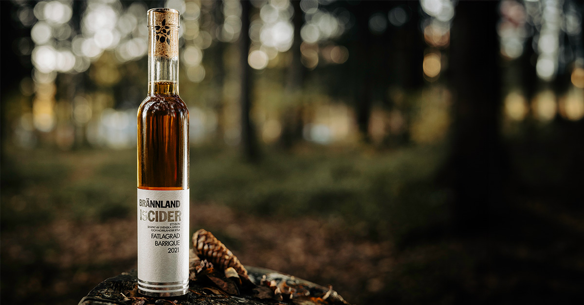 A bottle of Brännland Iscider Barrique in the woods.