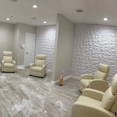 5 lounge chairs in a salt room with a halogenerator at Naked Wax Bar in Baton Rouge, Louisiana.