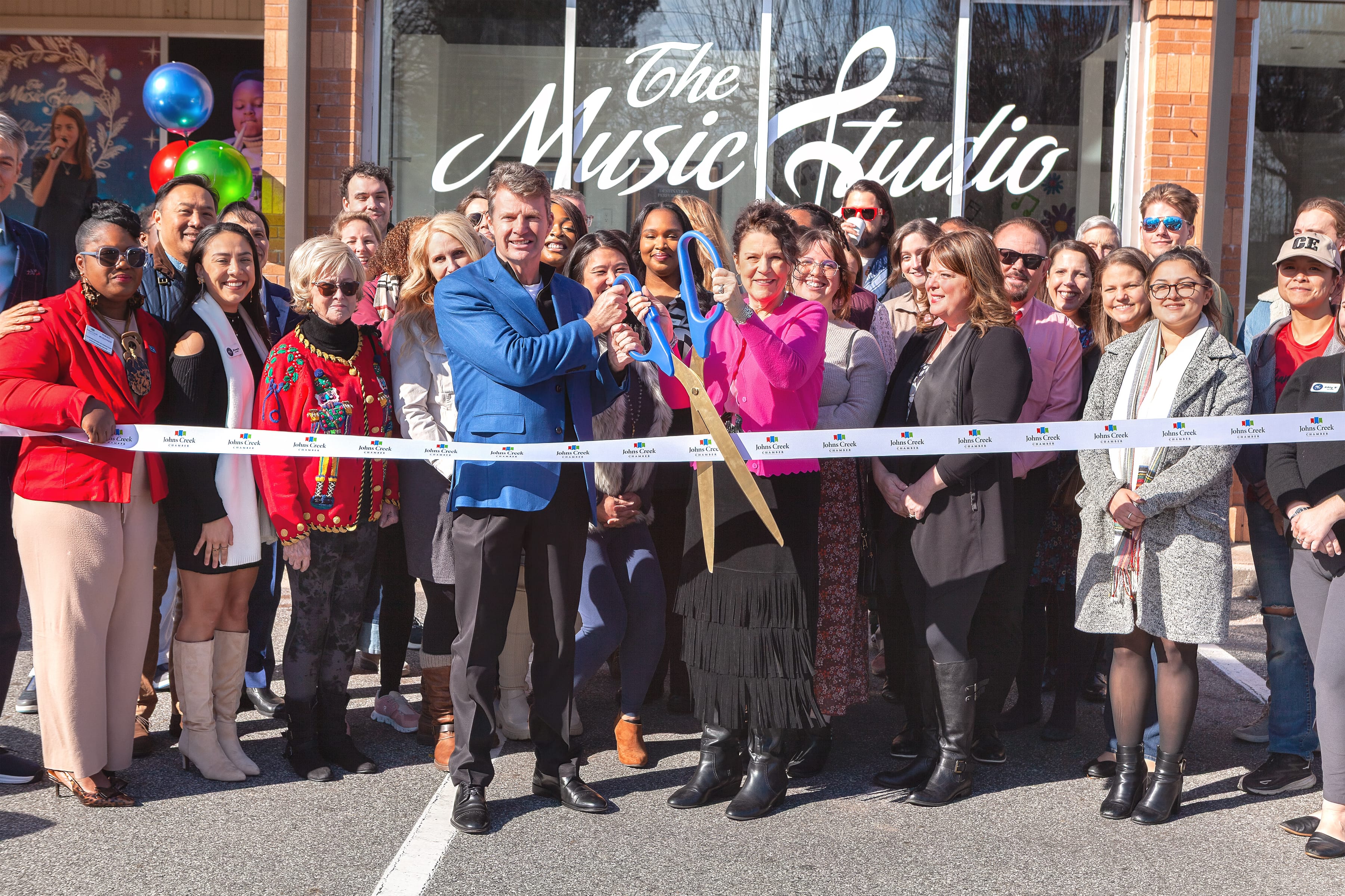Girl in blue dress performing Piano in Carnegie Hall in New York City.