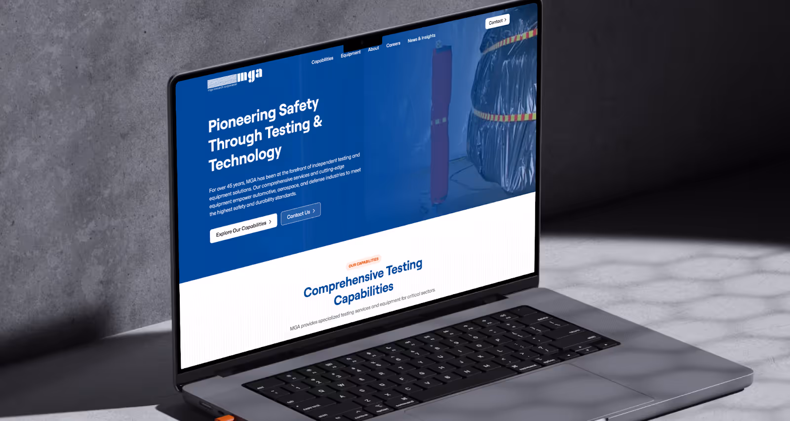 B2B company MGA Research Corporation's redesigned home page shown on a laptop computer