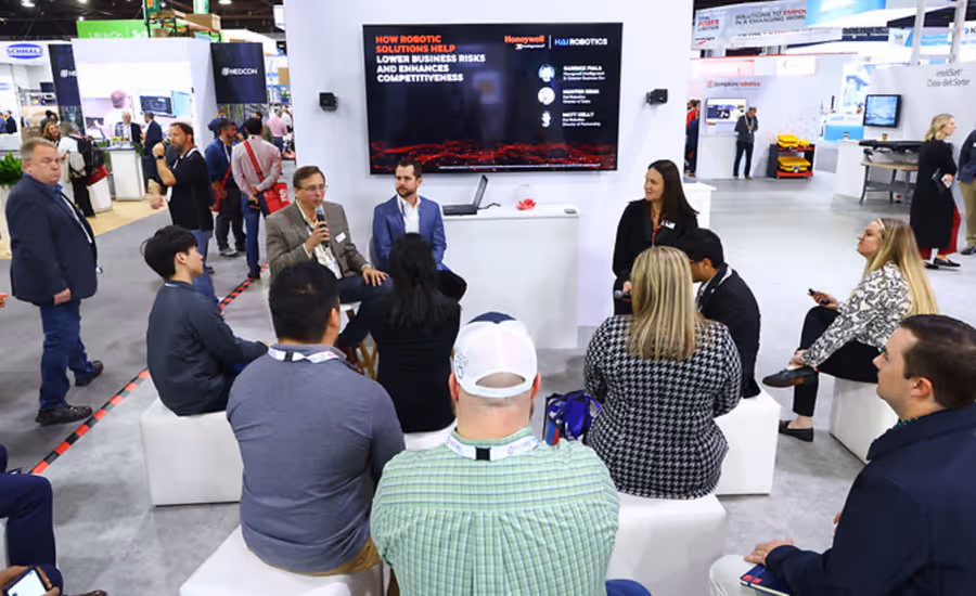 speaker presenting at a supply chain trade show booth at a previous MODEX trade show