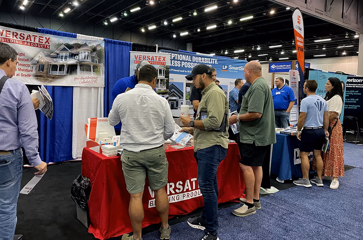 trade show attendees visiting the Versatex booth at a previous Build Expo USA trade show