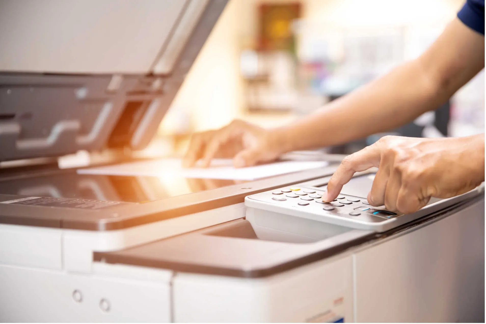 Man using printer copier in office 