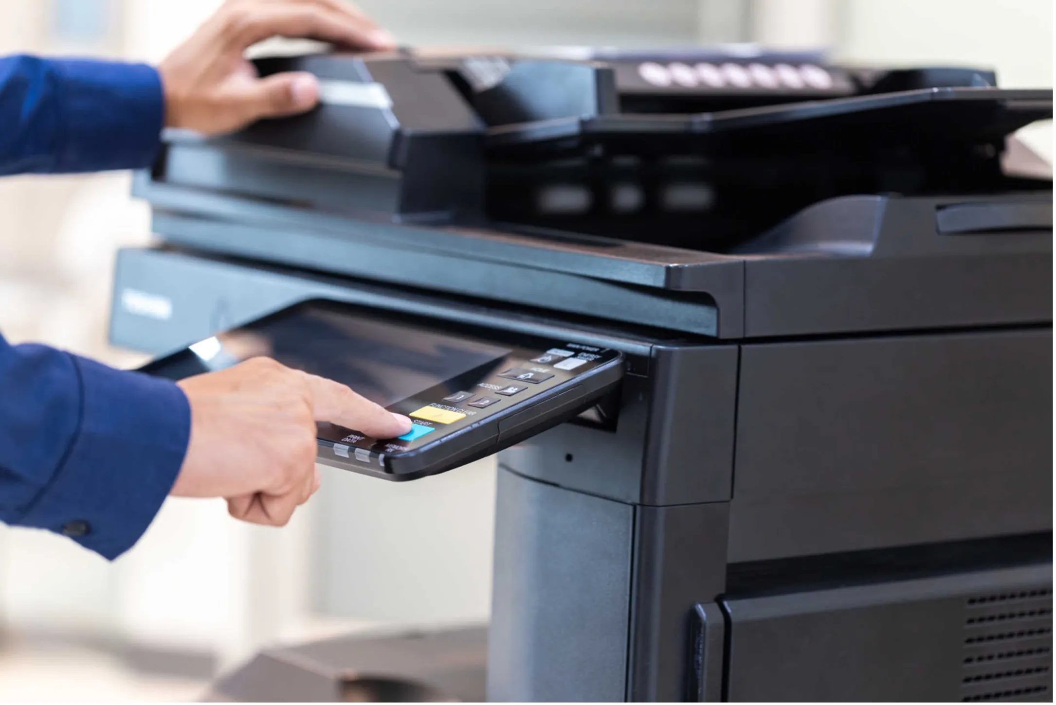 Man using a printer in an office