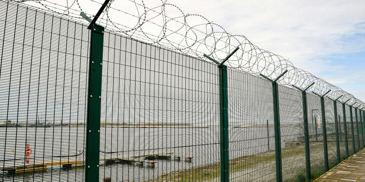 Automated security drone patrolling a site perimeter