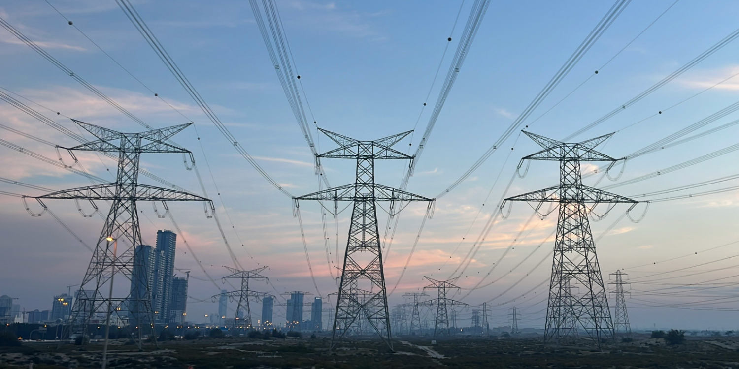 Drone inspecting high-voltage transmission towers