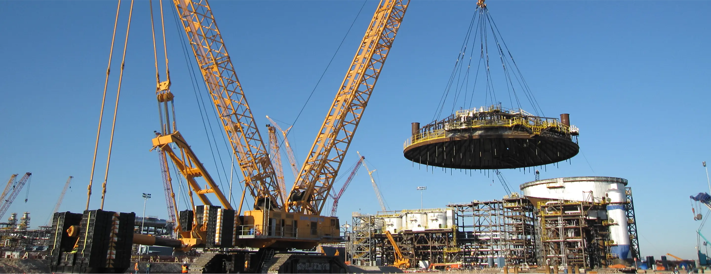 there is a crane that is lifting a large object in the air