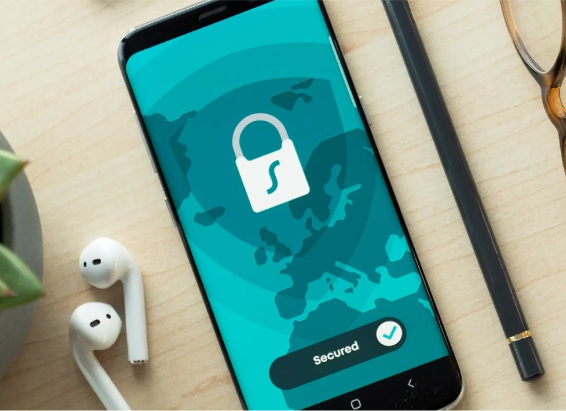 a close up of a cell phone with a lock on the screen