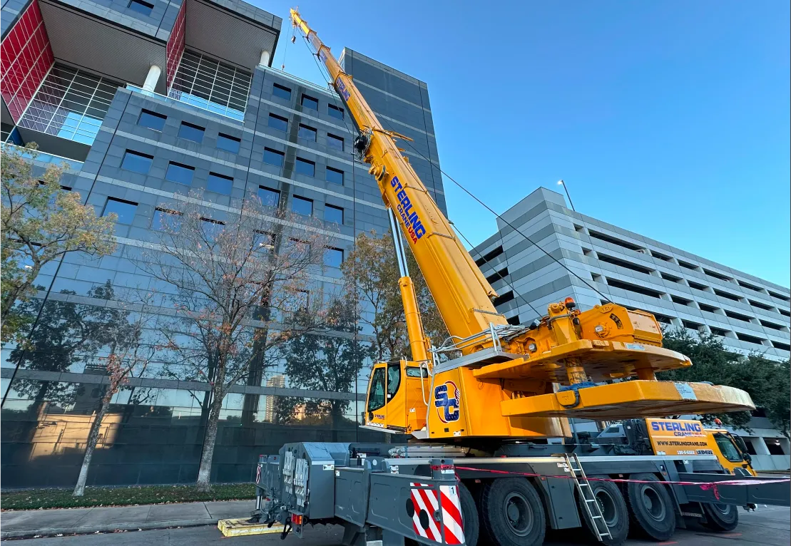 crane with a crane hook on a city street