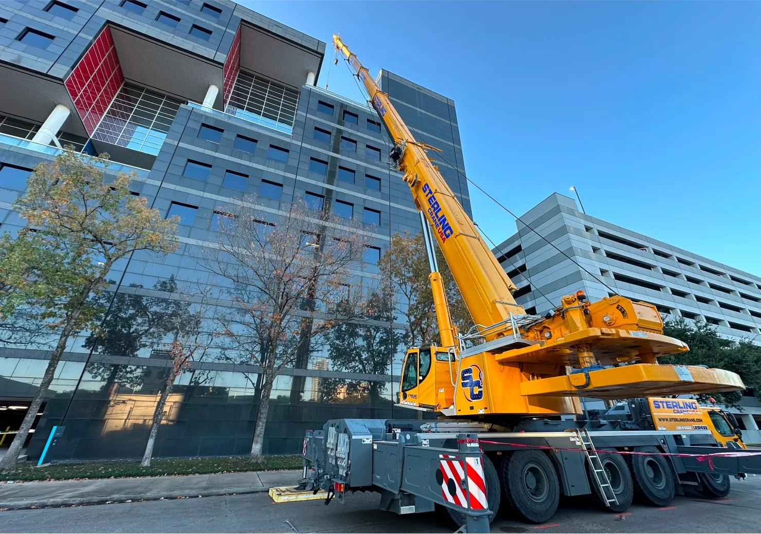 crane with a crane hook on a city street